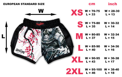 Size chart for Cherry Blossom Samurai Muay Thai Shorts with European standard sizes, showing measurements in cm and inches for XS to 2XL, handcrafted in Thailand.