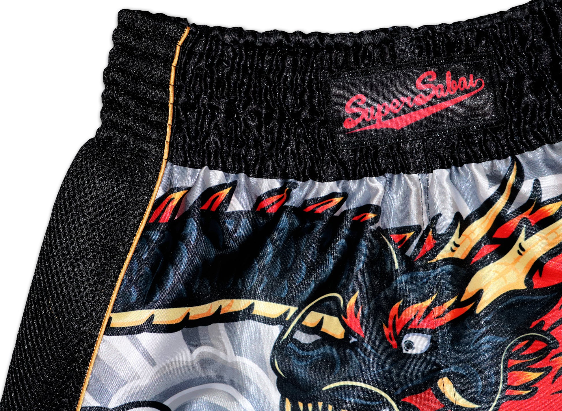 Close-up of the SuperSabai branded waistband on Irezumi Dragon Muay Thai Shorts, showcasing intricate dragon design details and premium stitching.