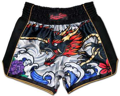 Front view of Irezumi Dragon Muay Thai Shorts featuring a fierce, black dragon with fiery red and gold accents, surrounded by traditional Japanese waves and flowers. Premium satin fabric with black mesh side panels, designed for comfort and durability in Muay Thai training and fighting