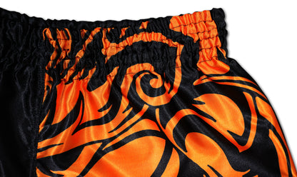 Detail view of Black and Orange Samurai Muay Thai Boxing Shorts with Tribal Design