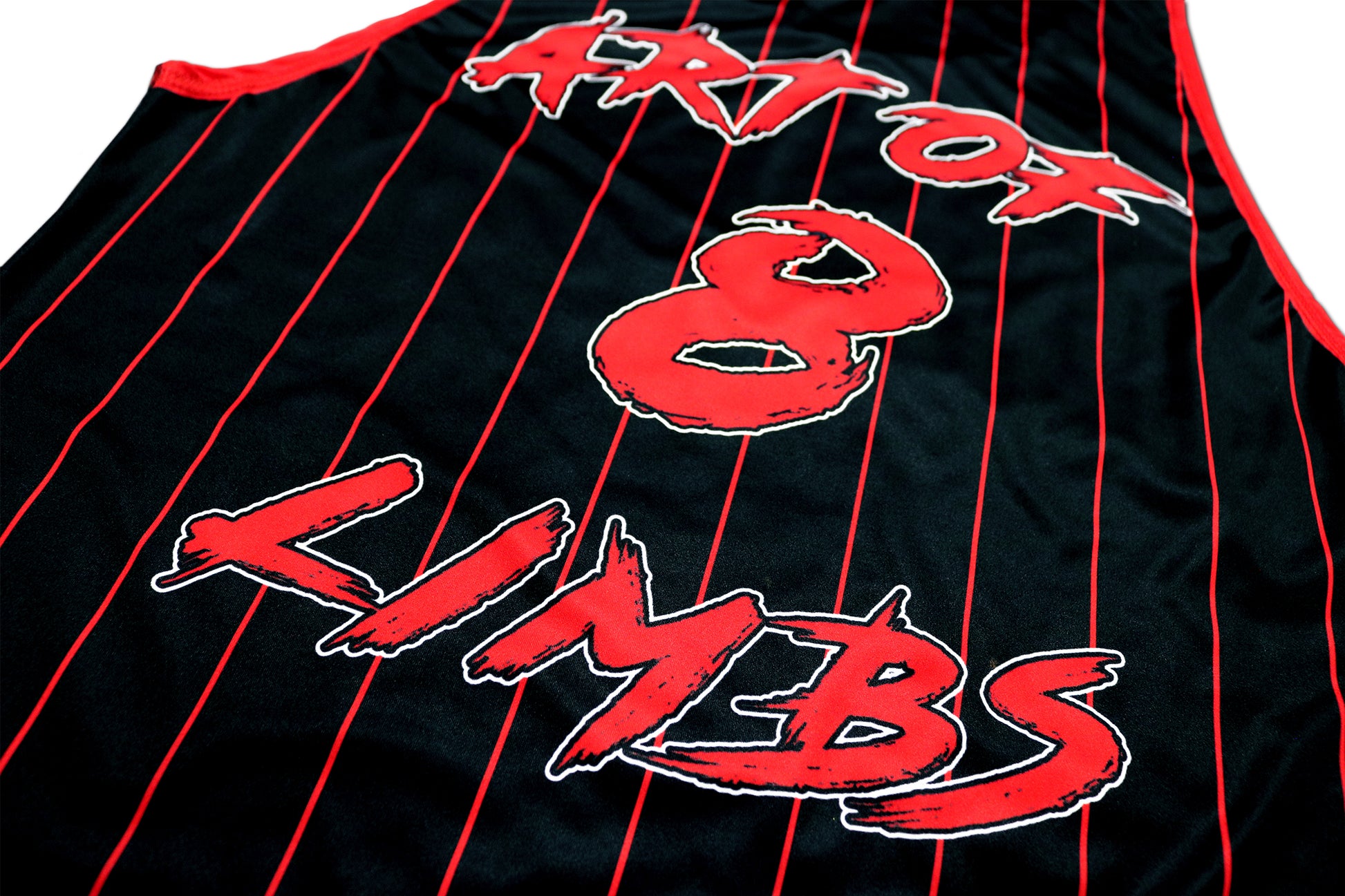 detail picture of a black muay thai tank top with red stripes and art of 8 limbs letters